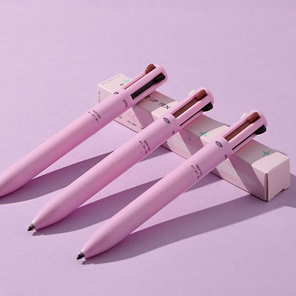 A set of four pink GlamPens with different colored makeup tips, displayed on a purple background, with the cap off showing the product details.